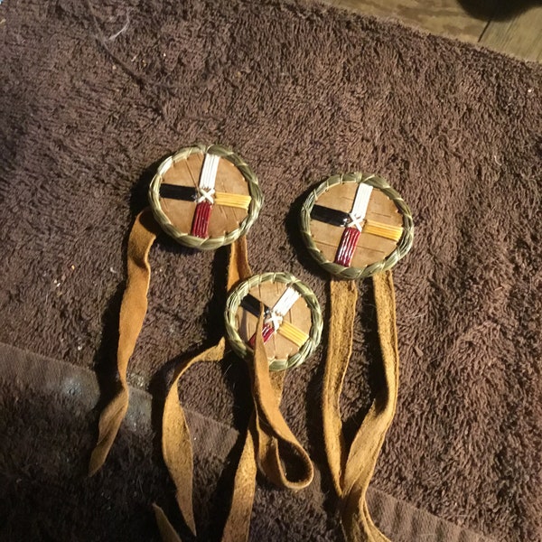 Porcupine quill embroidery, 3 rosettes with quilled medicine wheels.