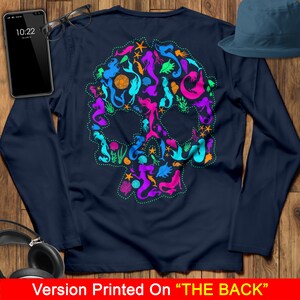May include: A navy blue long-sleeved t-shirt with a colorful skull design made up of mermaids, seahorses, and other sea creatures. The design is printed on the back of the shirt.