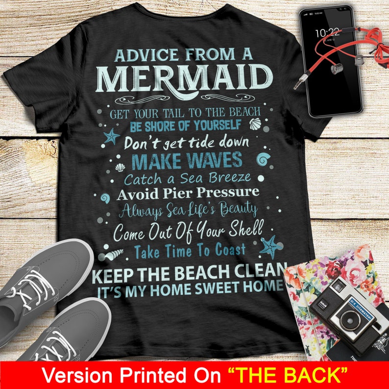 May include: Black t-shirt with white text that reads "Advice from a Mermaid" and includes a list of tips for beachgoers. The text includes phrases like "Get your tail to the beach", "Don't get tide down", "Make waves", "Catch a sea breeze", "Avoid pier pressure", "Always sea life's beauty", "Come out of your shell", "Take time to coast", "Keep the beach clean", and "It's my home sweet home".
