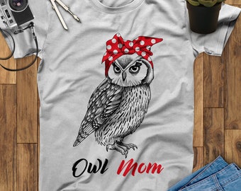May include: Gray t-shirt with a black and white illustration of an owl wearing a red and white polka dot bandana. The text "Owl Mom" is printed below the owl.
