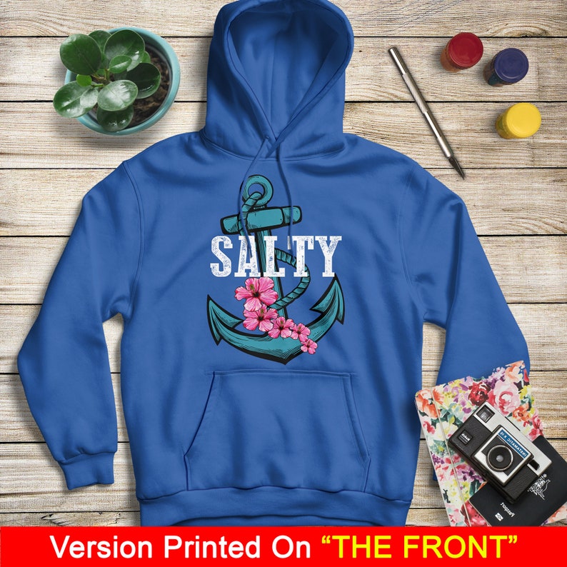 May include: A royal blue hoodie with a white anchor and the word "SALTY" printed on the front. The anchor is surrounded by pink flowers.