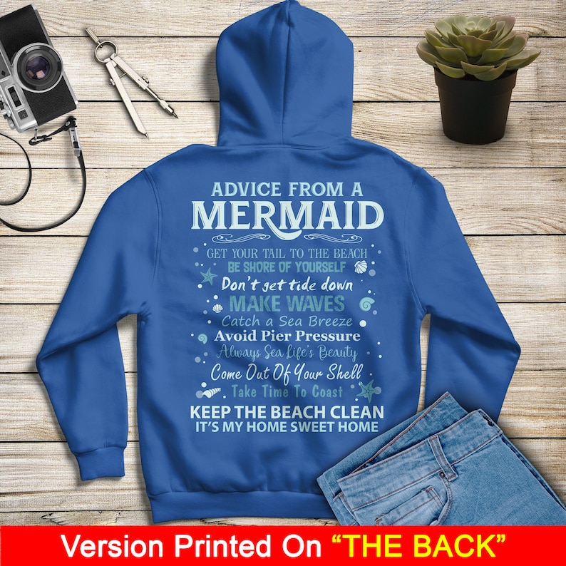 May include: Blue hooded sweatshirt with the text "Advice from a Mermaid" and a list of advice, including "Get your tail to the beach", "Don't get tide down", "Make waves", "Catch a sea breeze", "Avoid pier pressure", "Always sea life's beauty", "Come out of your shell", "Take time to coast", "Keep the beach clean", and "It's my home sweet home". The text is printed on the back of the sweatshirt.