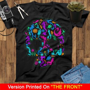 May include: A black t-shirt with a colorful mermaid skull design. The skull is made up of mermaids, seahorses, starfish, and other ocean-themed imagery.