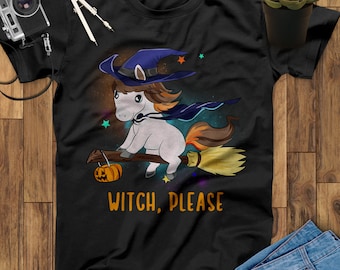 May include: Black t-shirt with a white unicorn wearing a witch hat and riding a broom with a pumpkin. The text "WITCH, PLEASE" is printed below the unicorn.