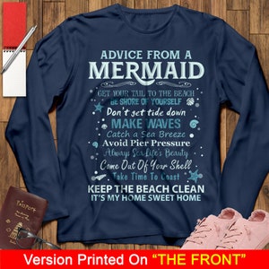 May include: A navy blue long-sleeved t-shirt with white text that reads "Advice from a Mermaid" and includes a list of tips for living a happy life. The text is surrounded by small blue and white illustrations of seashells, starfish, and waves.