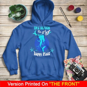 Peut inclure: Un sweat &agrave; capuche bleu royal avec un motif de sir&egrave;ne et le texte "The beach is my happy place".