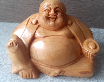 laughing Buddha in varnished wood