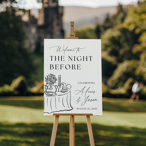 May include: A white wedding welcome sign on a wooden easel. The sign reads "Welcome to The Night Before" and includes the names "Alexis & Jason" and the date "August 21, 2025". A sketch of a table setting is at the bottom.