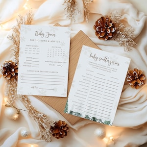 May include: Two baby shower game cards with snowflake accents. One card reads "Baby Jones Predictions & Advice" with fill-in-the-blank sections for birth details. The other card is titled "Baby Scattergories" with a list of baby-related categories.