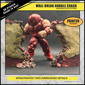May include: A painted diorama effects prop depicting a figure breaking through a brick wall. The figure is red and tan, and the wall is a mix of red brick and tan plaster. Text includes "WALL BREAK RUBBLE CRASH" and "PAINTED VERSION".