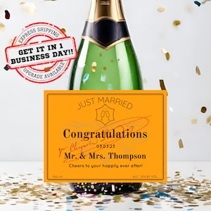 May include: A yellow and gold champagne bottle label with the text "Just Married" and "Congratulations Mr. & Mrs. Thompson" with the date "03.03.23". The label also includes the text "Cheers to your happily ever after!" and "750 ml" and "ALC. 12% BY VOL."