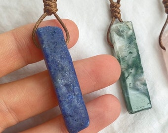 Raw natural lapis lazuli crystal shard necklace. High grade crystal pendant with adjustable brown drawstring cord.