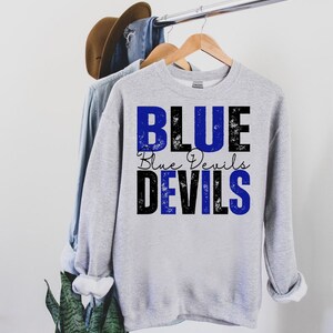 May include: Gray sweatshirt with a blue and black graphic that says "BLUE Blue Devils DEVILS".