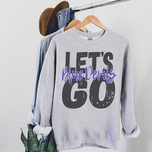 May include: Gray sweatshirt with the text "Let's Blue Devils Go" in black and purple lettering.