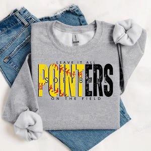 May include: Gray sweatshirt with the text "Leave it all" above the word "Pointers" in yellow and black with a softball graphic. The text "Softball" is written in white letters on the yellow portion of the word "Pointers". The text "On the field" is written below the word "Pointers".