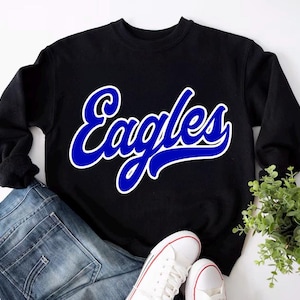May include: Black sweatshirt with a blue and white "Eagles" graphic on the front.