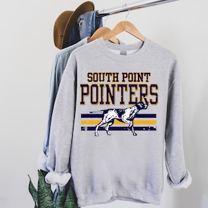 May include: A gray sweatshirt with the text "South Point Pointers" in navy blue and yellow. A black and white illustration of a dog is below the text.