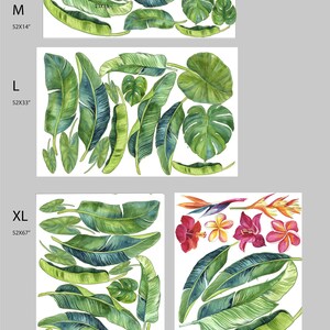 May include: Four sizes of tropical leaf wall decals, with the largest size showing a mix of green leaves and pink and orange flowers. The sizes are labeled S 25x17", M 52x14", L 52x33", and XL 52x67".