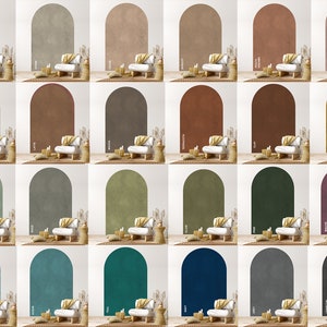 Op de afbeelding: Een verzameling van 20 boogvormige muurstickers in verschillende kleuren, waaronder grijs, bruin, groen, blauw en paars. Elke sticker heeft een textuur, een licht verweerde afwerking, wat een unieke en rustieke touch aan elke kamer geeft.