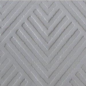 Può includere: Un tessuto bianco testurizzato con un motivo geometrico di linee diagonali che creano un design a chevron.