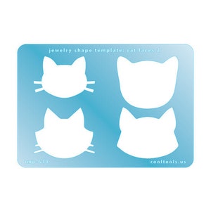 May include: Blue template sheet with four cat face shapes for jewelry making. The text "jewelry shape template: cat faces 2" is at the top of the sheet. The text "Imp-610" is at the bottom left and "cooltools.us" is at the bottom right.