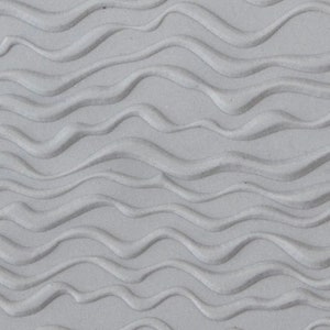 May include: A close-up of a textured, gray surface with a wavy pattern.