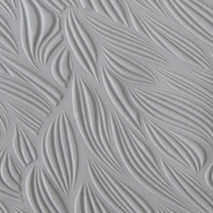 May include: A close-up of a textured, grey surface with a repeating pattern of curved lines. The lines create a wave-like effect, resembling a flowing fabric.