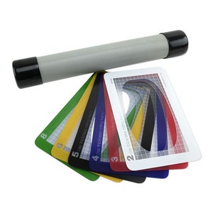 May include: A set of seven colourful plastic rolling frames for clay, numbered 2 through 8. The frames are used to create consistent thickness and shape in clay projects.