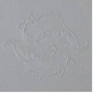 May include: A white background with two stylized fish designs in a circle. The fish are facing each other and have a detailed design.