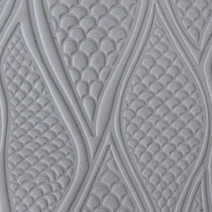 May include: A white textured background with a repeating pattern of overlapping, wavy, scale-like shapes.