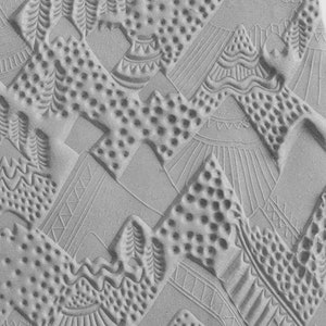 May include: A close-up of a grey textured surface with a repeating pattern of geometric shapes and dots. The pattern is reminiscent of ancient Egyptian art.