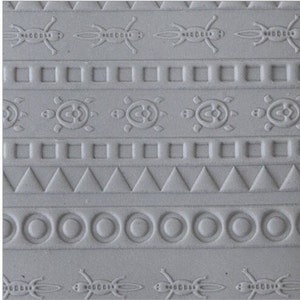 May include: A close-up of a gray textured surface with a repeating pattern of geometric shapes, including squares, triangles, circles, and stylized images of turtles and insects.
