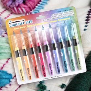 May include: A value pack of Crochet Lite crochet hooks in various colors, including yellow, orange, red, pink, purple, blue, teal, and green. Each hook has a black grip and a silver hook tip. The packaging includes the text "The Crochet Lite Value Pack".