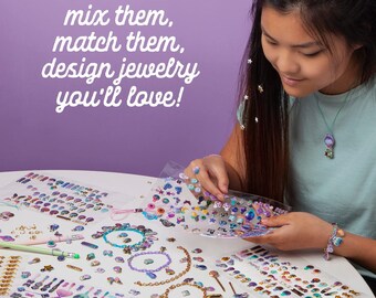 May include: A girl is designing jewelry with colorful stickers and charms. The stickers are on sheets and the charms are loose. The text on the image says "mix them, match them, design jewelry you'll love!"