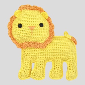May include: A handmade crochet lion toy in yellow with an orange mane and tail. The lion has black button eyes and a stitched orange nose and mouth. The toy is designed with a friendly, cartoonish appearance.
