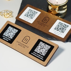 May include: Two wooden hotel room service signs with QR codes and the Longridge House logo. One sign reads "Scan for Hotel Directory" and the other says "Scan to view our in-room dining menu."