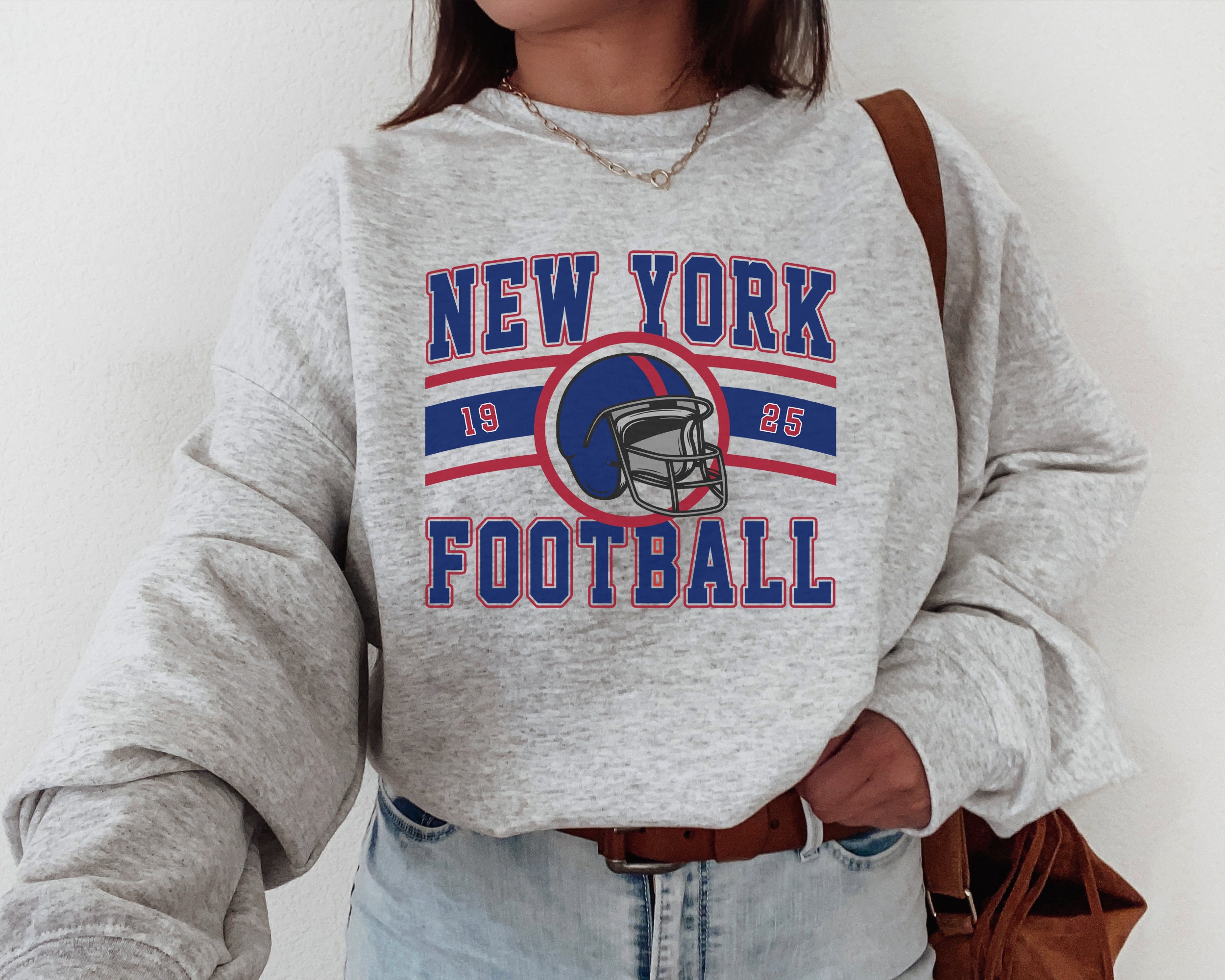 New York Giants Helmet Retro T-Shirt from Homage. | Officially Licensed Vintage NFL Apparel from Homage Pro Shop.