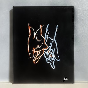 May include: Black canvas art featuring a minimalist line drawing of two hands holding each other. The hands are outlined in orange and blue, creating a striking contrast against the black background. Signed in the bottom right corner.