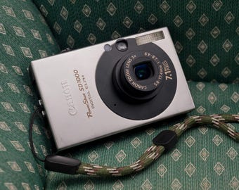 Canon Powershot SD1000: Câmera digital retrô compacta com zoom grande angular de 3x e sensor CCD de 7,1 megapixels (testada).