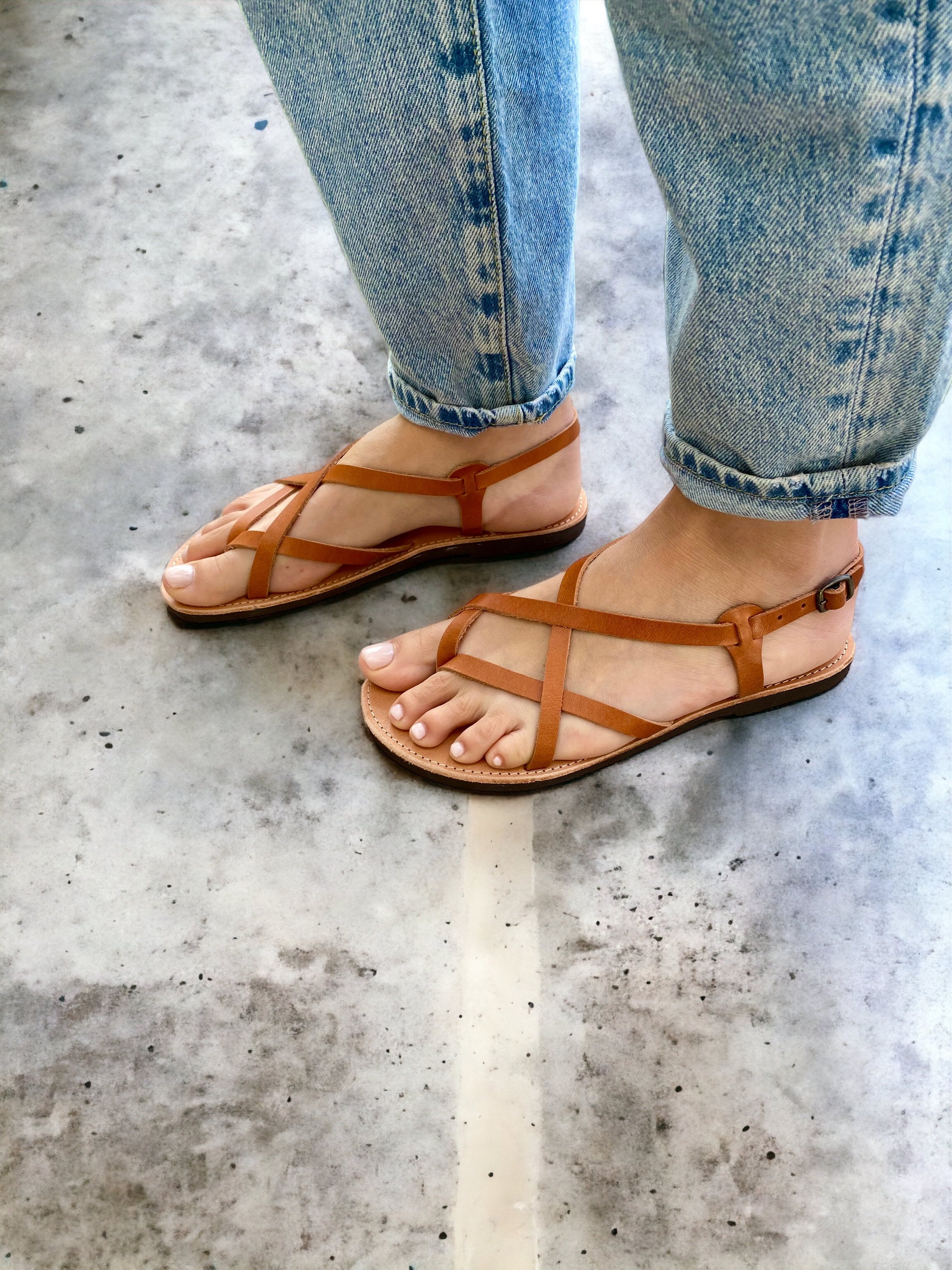 Wearing Strappy Sandals witha pair of straight jeans