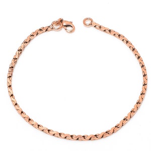 以下が含まれることがあります： ロブスタークラスプクロージャーが付いたローズゴールドチェーンブレスレット