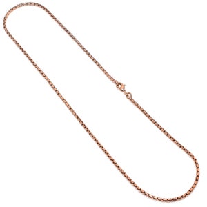 May include: A rose gold chain necklace with a lobster clasp closure.