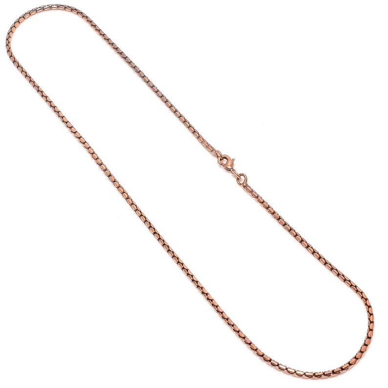 May include: A rose gold chain necklace with a lobster clasp closure.