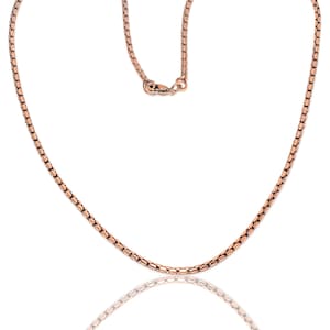 May include: A rose gold chain necklace with a lobster clasp closure.