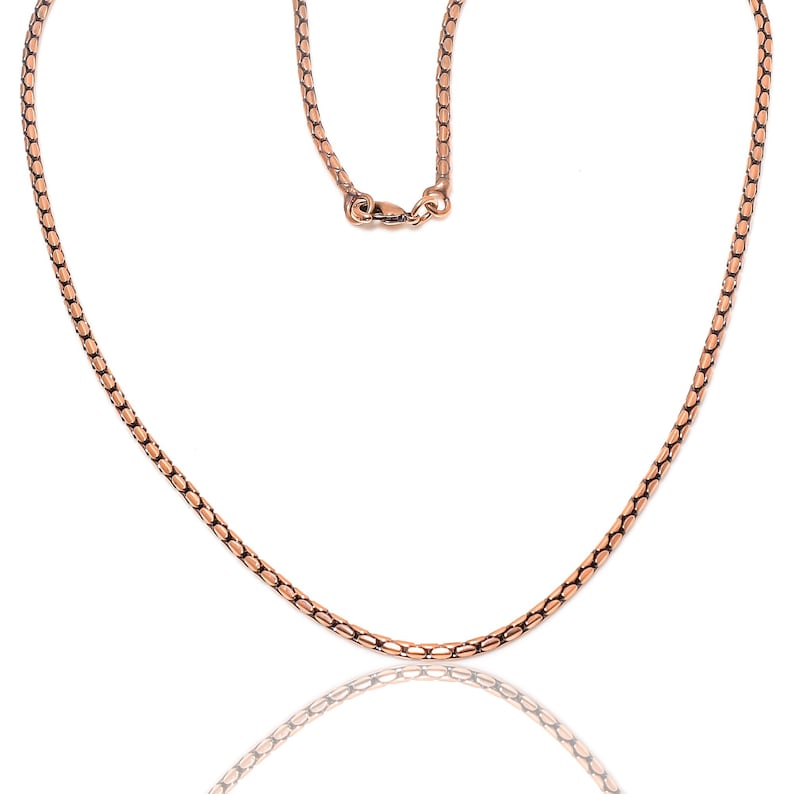 May include: A rose gold chain necklace with a lobster clasp closure.