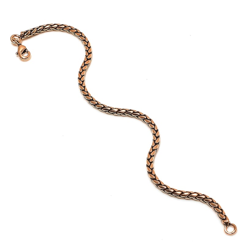 May include: A gold-toned chain bracelet with a lobster clasp.