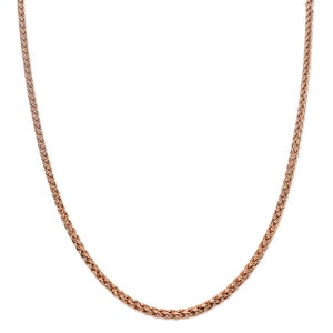 May include: A rose gold chain necklace with a braided design.