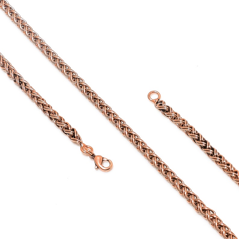 May include: A rose gold chain necklace with a braided design. The chain is shown in two pieces, one with a clasp and one without.