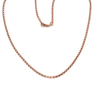 May include: A rose gold chain necklace with a lobster clasp.