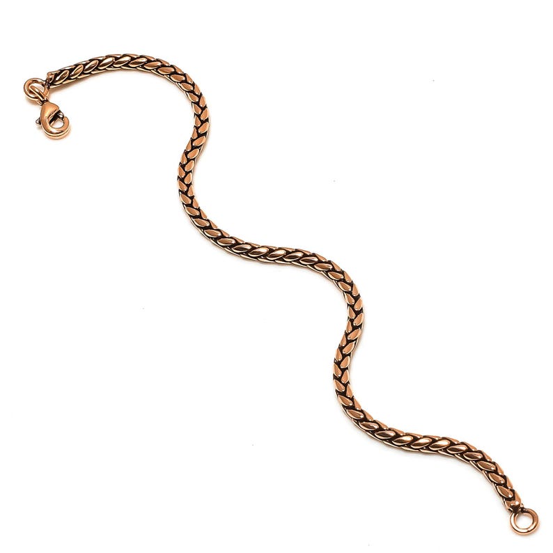 May include: A gold-toned chain bracelet with a lobster clasp.